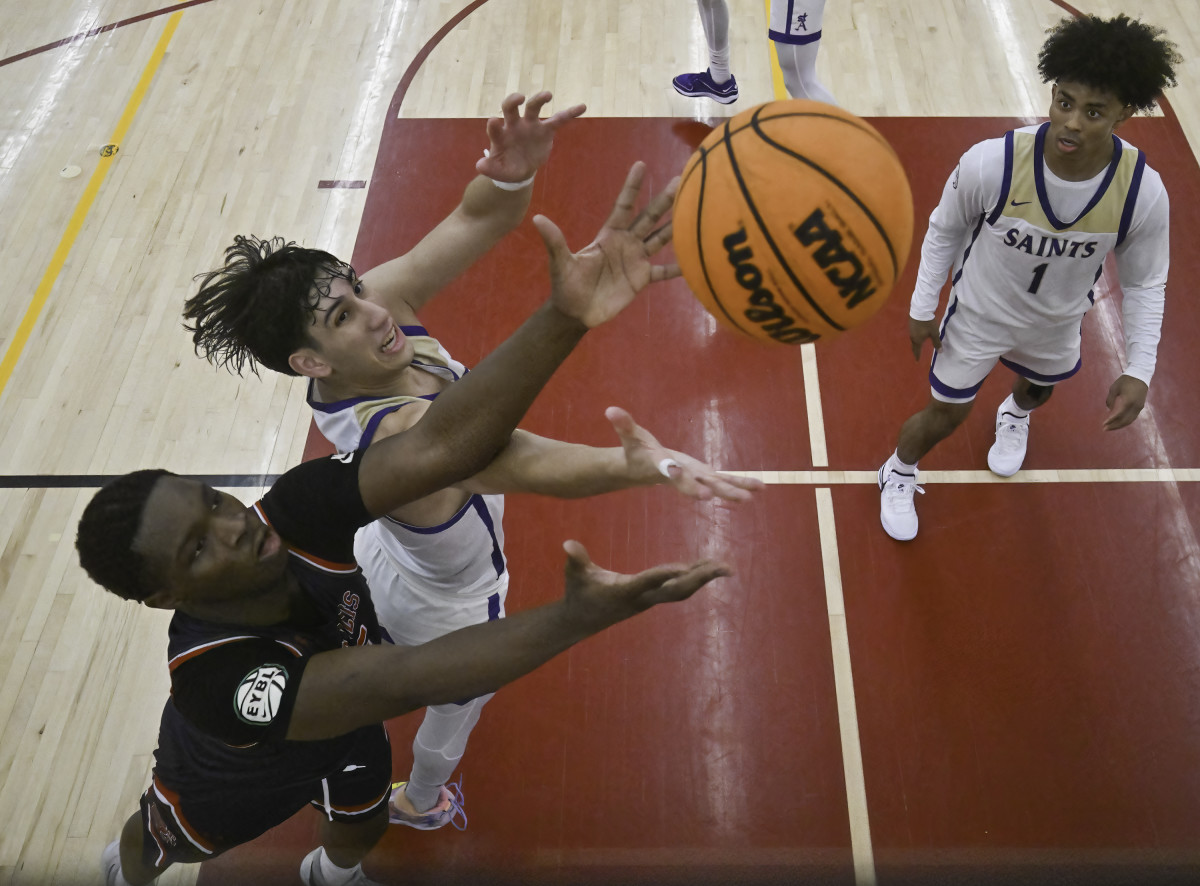 St. Augustine's Ian De La Rosa battles for a rebound against St. Francis (New York) at December's Torrey Pines Holiday Classic